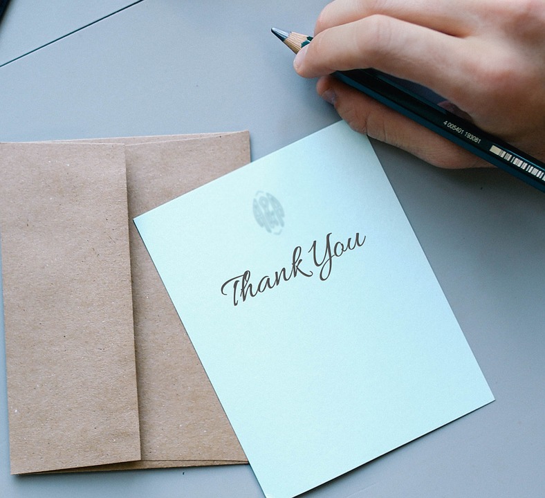 thank you written on a card