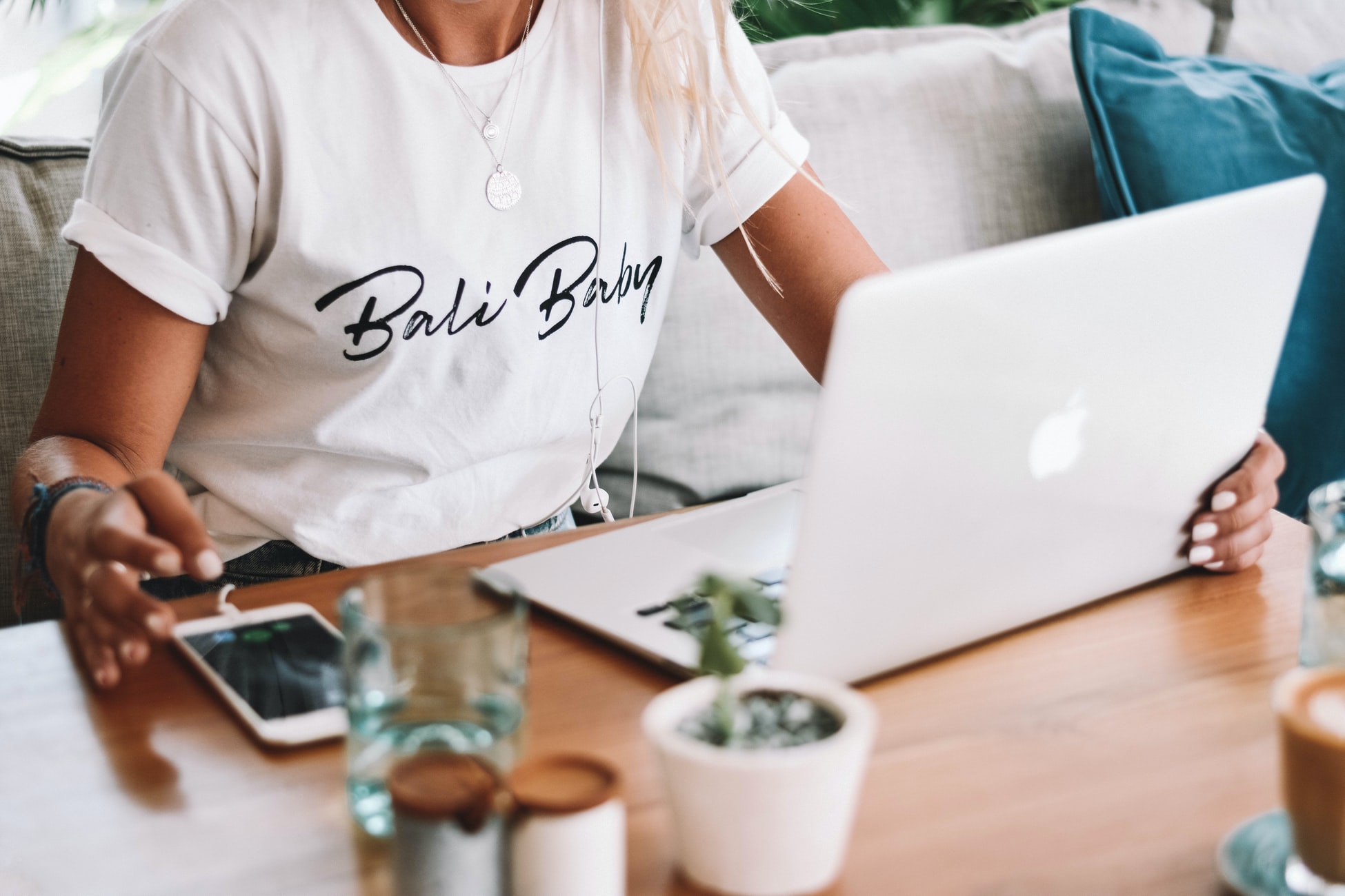 women working on a macbook