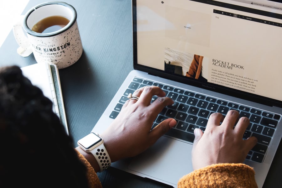 woman working on MacBook